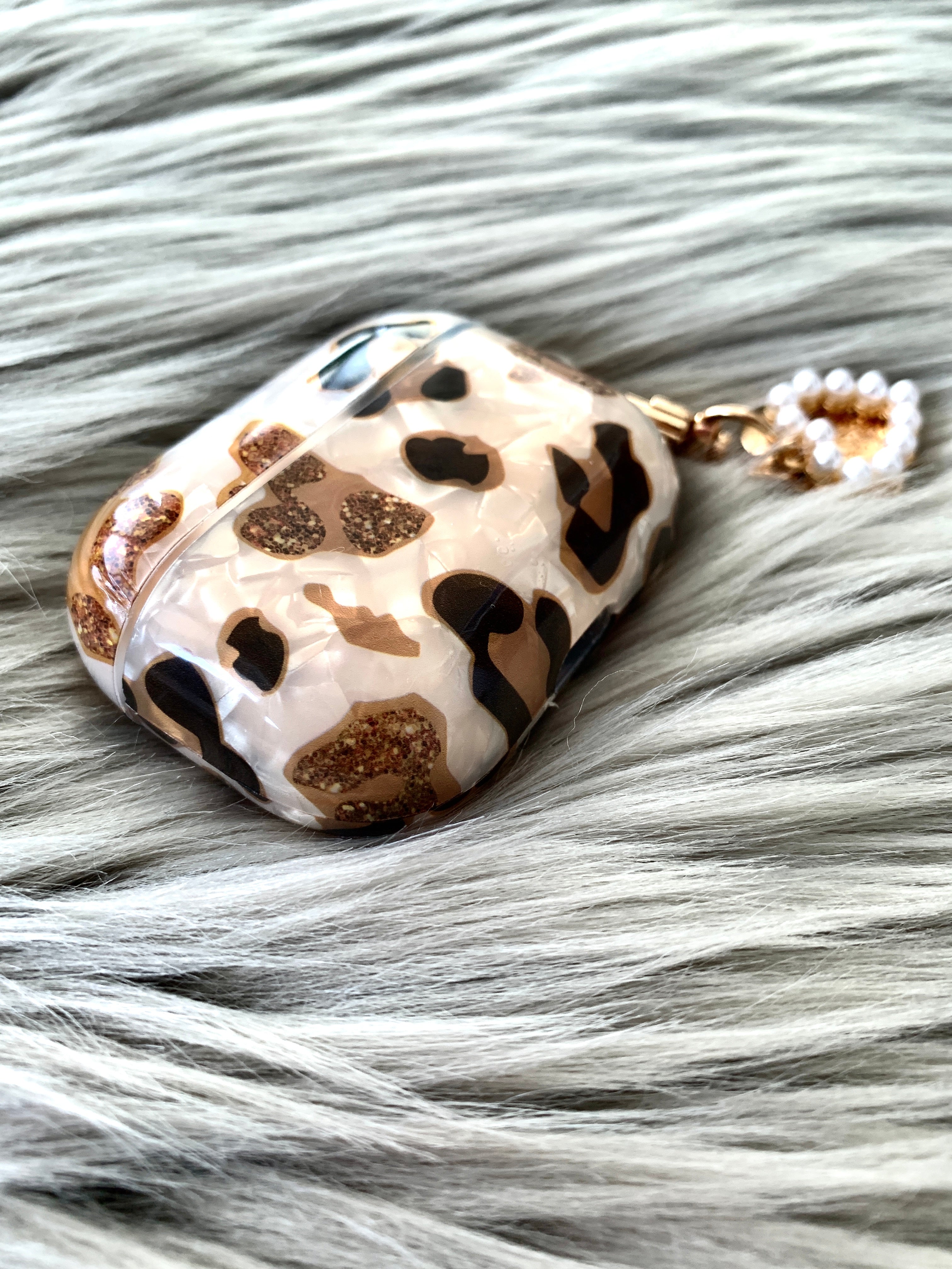 Close up of the Leopard Pearl AirPods Case with Pearl Heart Keychain - KokoLoveCo - Wireless Charging MagSafe Compatible AirPods Case